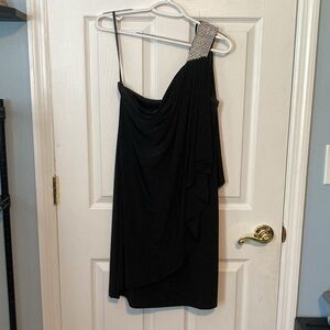 Cache One shoulder black dress with diamond accent on left shoulder. Size 12.